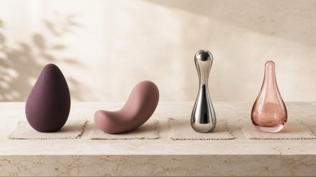 Silicone, steel and glass pleasure products arranged to compare material surfaces