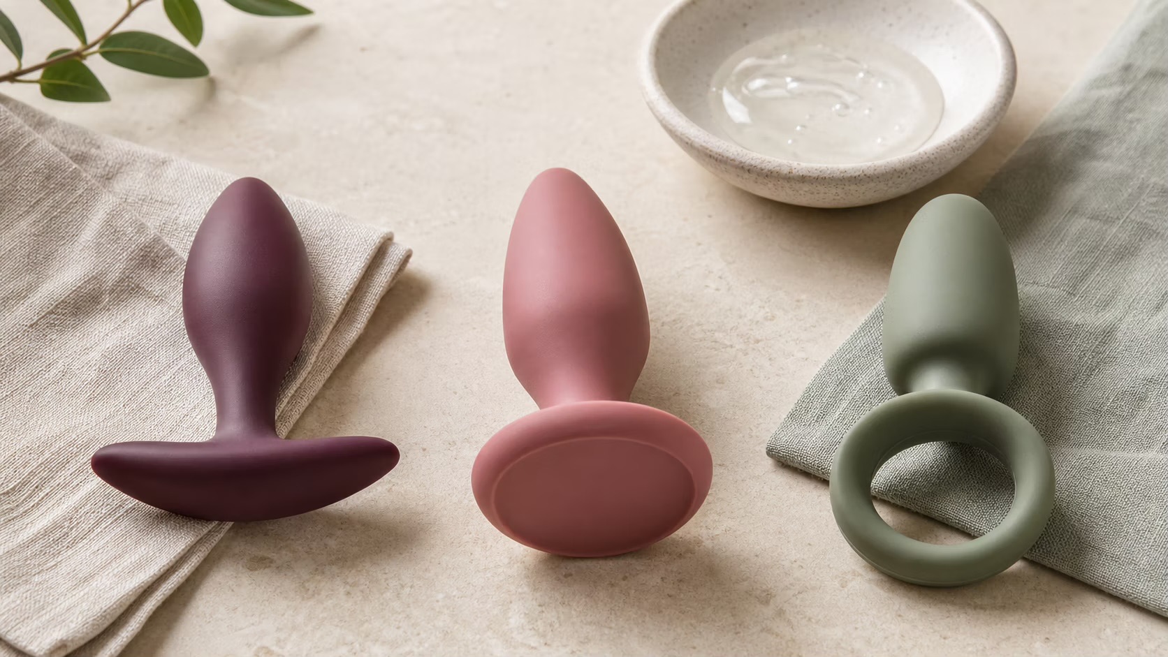 Purpose-built anal products arranged to show wide bases and retrieval shapes