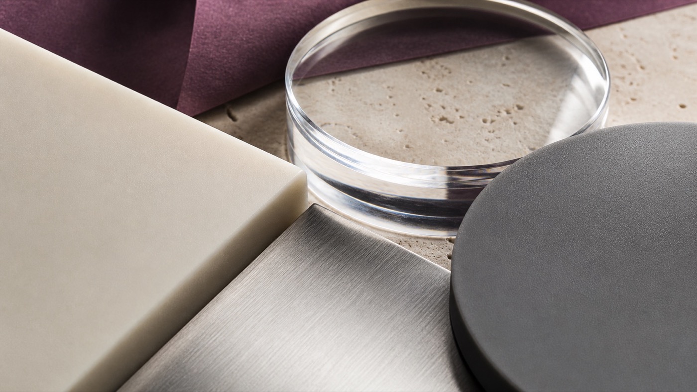 Macro study of matte silicone, clear glass, stainless steel and smooth polymer